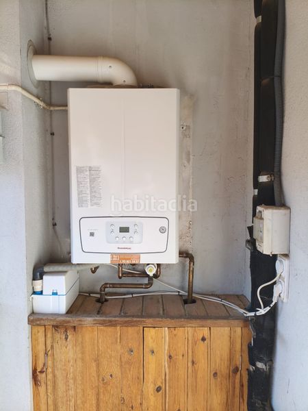 Foto c2b67ebb-6f0b-4679-9464-622d22db6546. Dúplex amb xemeneia calefacció a Puig-reig