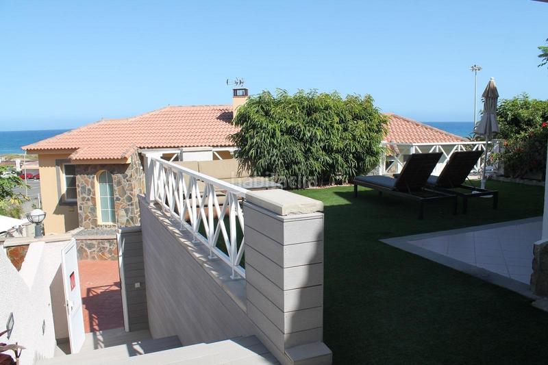 Foto 47ab8aa2-633b-4c43-8ba4-0ddd7f1a0edd. Casa pareada en calle costa canaria 114 en Playa del Inglés San Bartolomé de Tirajana