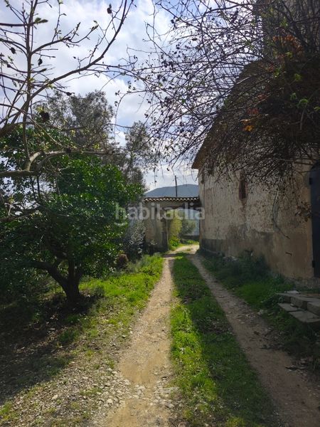 Foto 69613126-749f-4d6d-b37a-3ab6c7574d89. Masia amb xemeneia aparcament a Corbera de Llobregat