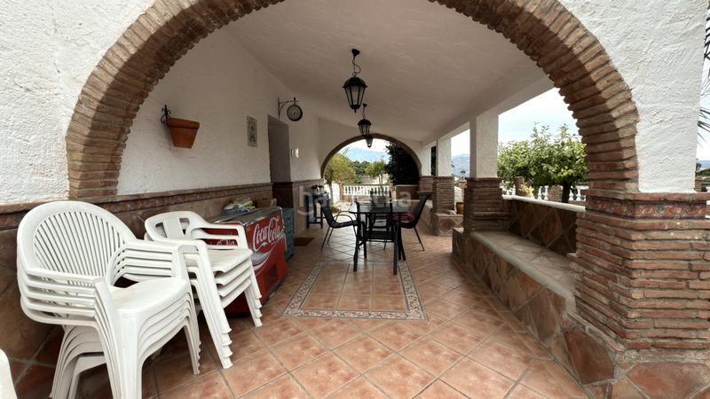 Foto 79fb1056-6952-430f-95a3-251c1141f4a7. Affitto casale con camino piscina in Benamocarra