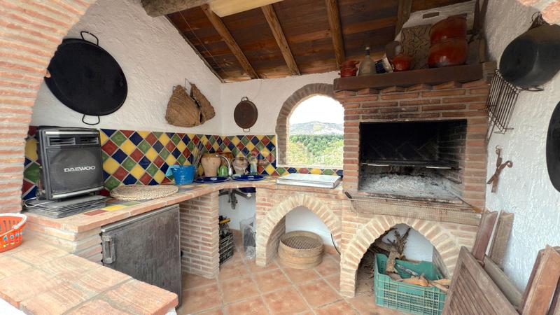 Foto f4d3cc95-443a-4c4a-8747-1bbd2edd5868. Affitto casale con camino piscina in Benamocarra