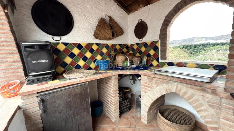 Foto f5dc4b72-ee62-4392-9e9d-eaf07fdd7099. Affitto casale con camino piscina in Benamocarra