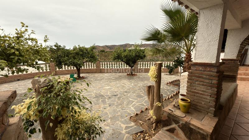 Foto f8646dfe-4a15-4246-9b50-17f3d435d993. Affitto casale con camino piscina in Benamocarra