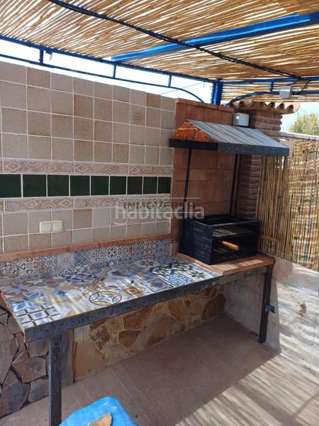 Foto ef8aebf9-7edf-4a05-8532-44c066021409. Maison avec parking dans Moclinejo