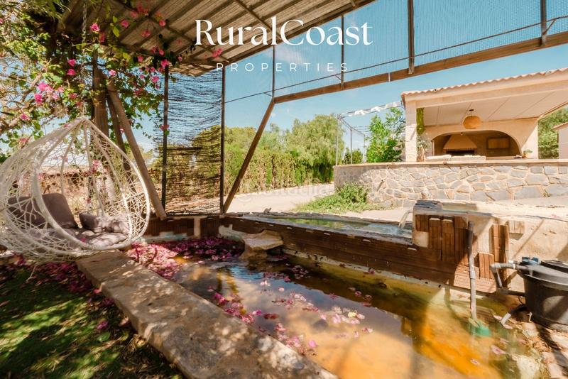 Foto bca9b53d-cf20-44e7-b3a6-e4da6ababfc7. Chalet finca exclusiva con vistas abiertas, olivos centenarios y cercanía al mar en elche rural en Elche / Elx