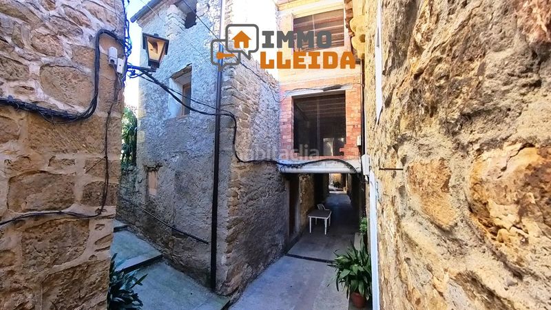 Foto bcb9f6d6-f45c-430e-9b0c-c9fec2dfff1c. Casa adossada a calle major a Vilanova de Meià