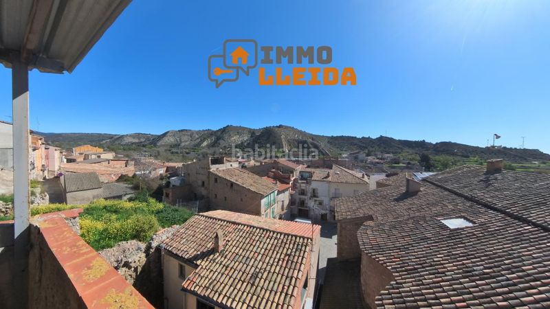 Foto 3ba453aa-e8a7-4524-9596-ba91dd0ad9f2. Casa adosada en calle santa maria encanto y amplitud en el corazón en Castelló de Farfanya