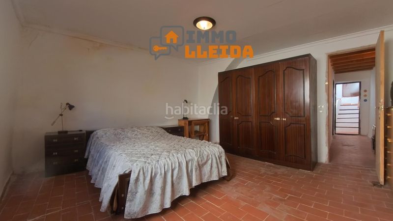 Foto 938ff965-879a-4b1e-b14b-b096a3a70448. Casa adosada en calle santa maria encanto y amplitud en el corazón en Castelló de Farfanya