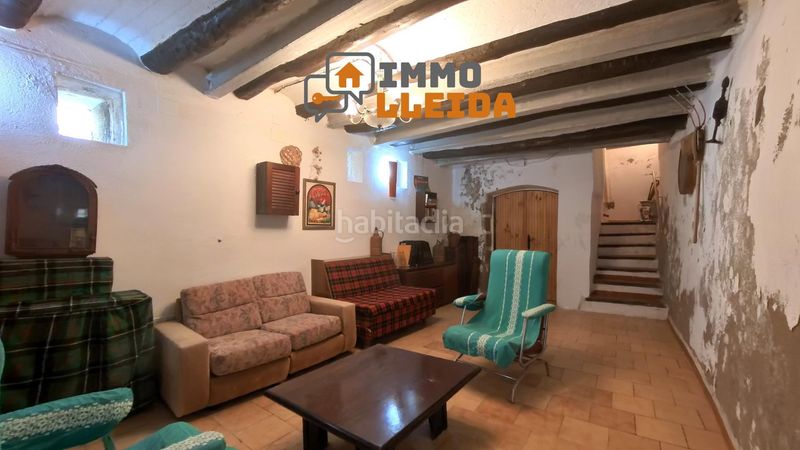 Foto c78a4157-ba5f-473c-92f2-28b01c0e8c8f. Casa adosada en calle santa maria encanto y amplitud en el corazón en Castelló de Farfanya
