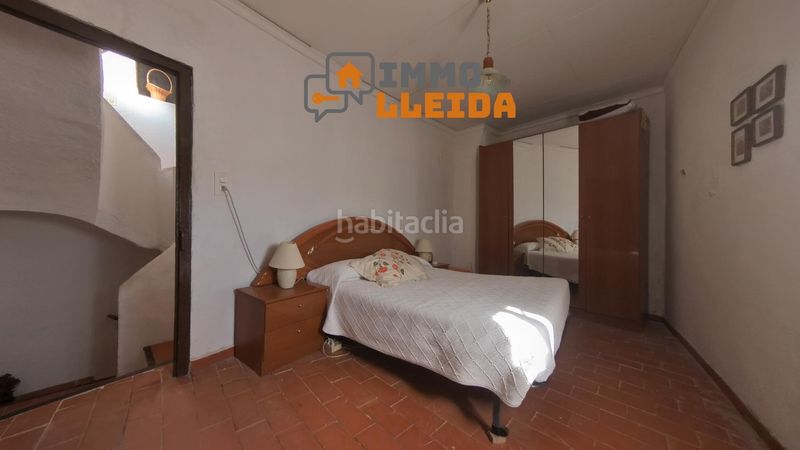 Foto cf00a455-8da4-4fb1-bb5d-69aa157aa0f0. Casa adosada en calle santa maria encanto y amplitud en el corazón en Castelló de Farfanya