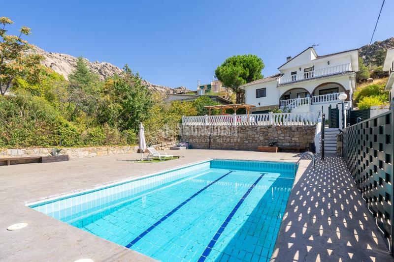 Foto 6a89fe7e-34ee-482a-917f-8632a577a7d3. Casa aparellada amb calefacció aparcament piscina a Manzanares el Real