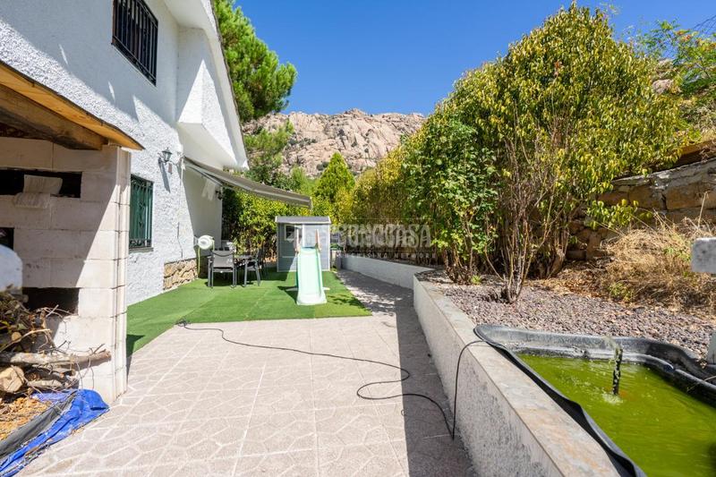 Foto 99aaba1b-9802-452a-b19b-b9cbeeacaf56. Casa aparellada amb calefacció aparcament piscina a Manzanares el Real