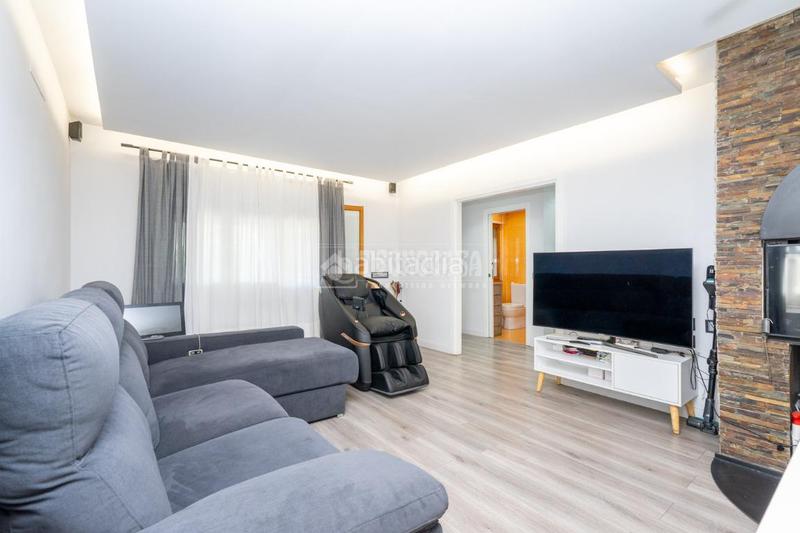 Foto cbbadcfd-62ce-4bf0-8ef7-0b5c13b388d5. Casa aparellada amb calefacció aparcament piscina a Manzanares el Real