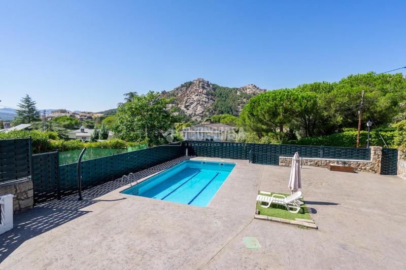 Foto f4a1ff16-9f0a-4d47-bc4e-bd853d70410a. Casa aparellada amb calefacció aparcament piscina a Manzanares el Real