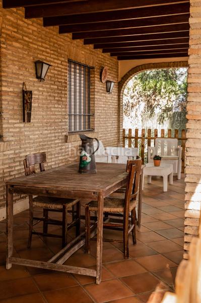 Foto 1a14a6ae-4250-41c6-89e1-daf2dc2fa1b3. Xalet amb xemeneia piscina a Loreto Espartinas