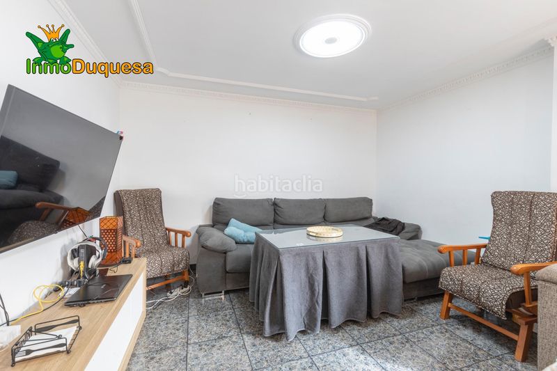 Foto 2f8da8e7-1f4d-4e5a-b359-c97a1a387571. Casa aparellada amb aparcament a Atarfe