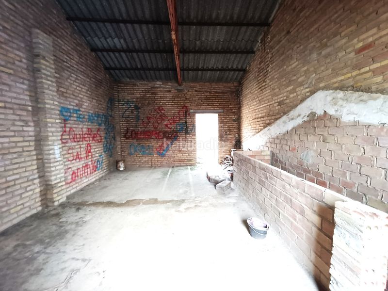 Foto bf6e7341-9019-4e99-95a6-25d033326897. Casa adossada amb xemeneia aparcament a Olivares