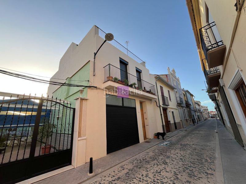 Foto c1f815be-e61a-47d6-a80a-2ff1cd2c0c64. Casa adossada amb xemeneia aparcament a Polinyà de Xúquer