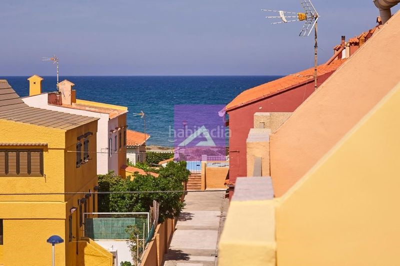 Foto c260554d-d5ef-48cf-88bd-d353743b7ea5. Casa adossada amb aparcament a Mareny de Barraquetes Sueca