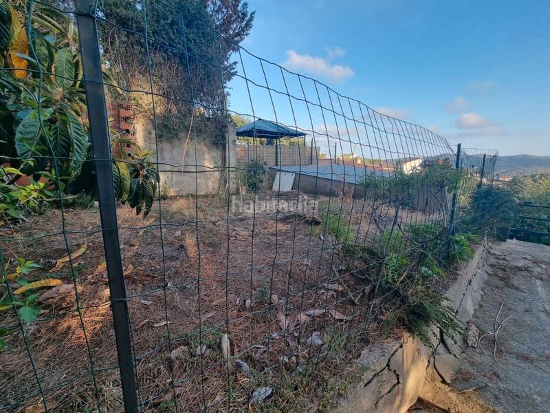 Foto 3f2642df-928f-4744-b32c-1b74242c8c85. Terreno residencial terreno con pequeña construccion en Dosrius