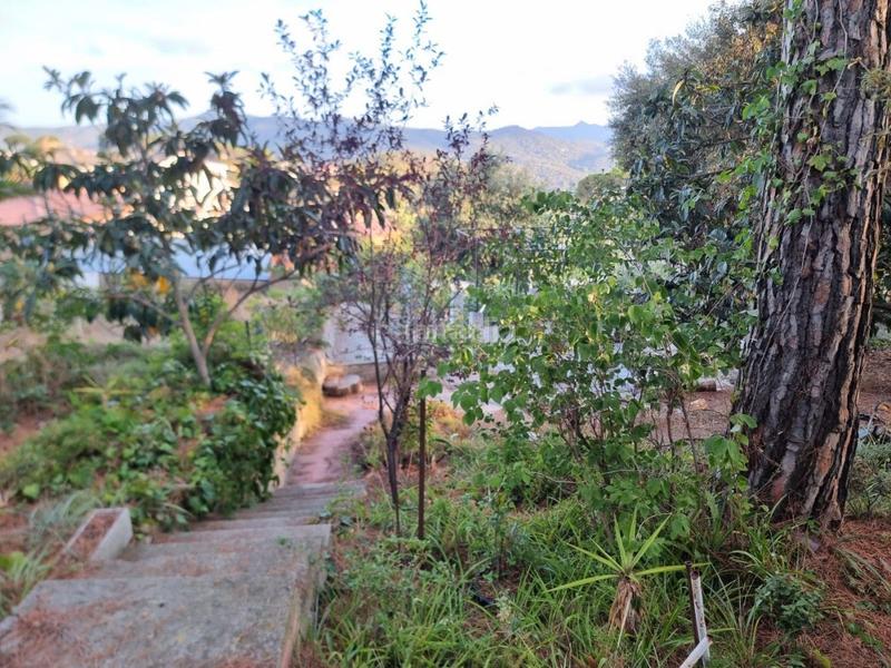 Foto e7a4b701-fb48-45d3-bbdb-1767068886df. Terreno residencial terreno con pequeña construccion en Dosrius