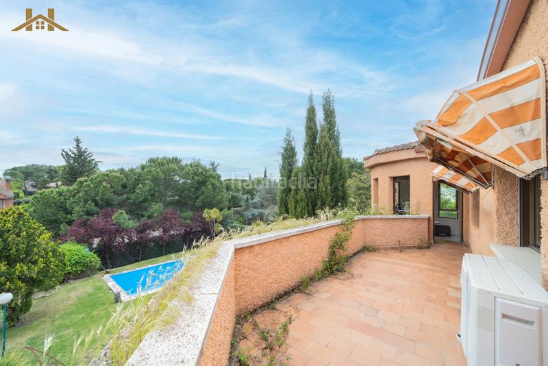 Foto 49abd94e-c4fa-4bcf-be31-2498875ee0cd. Casa amb calefacció aparcament piscina a El Olivar de Mirabal Boadilla del Monte