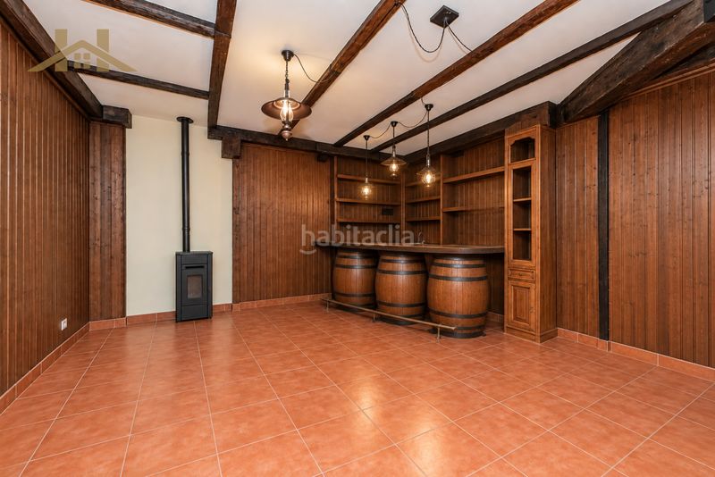 Foto c1d206cf-d8ab-4b9a-bae9-1fad7e987469. Casa aparellada amb xemeneia calefacció aparcament piscina a Majadahonda