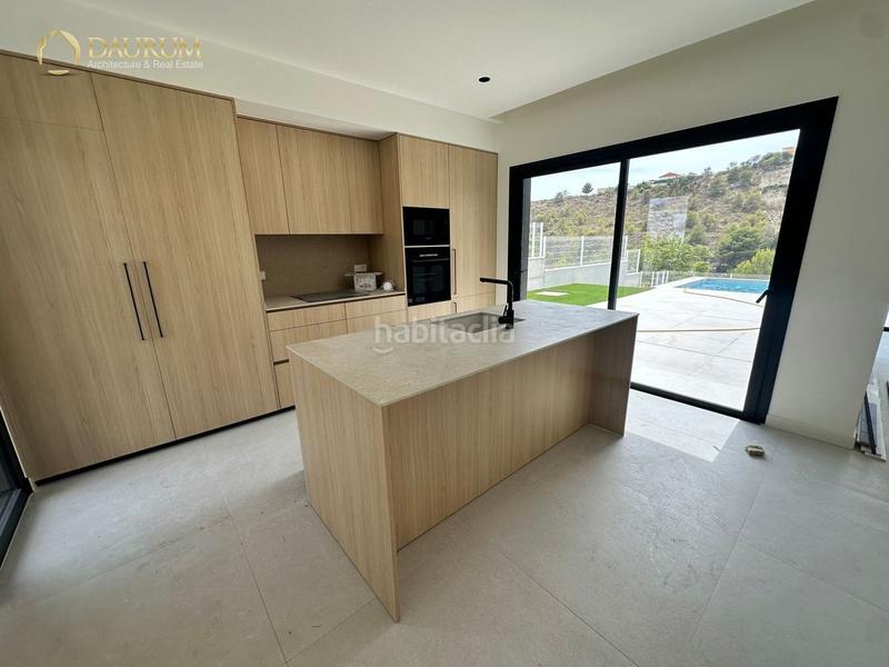 Foto 5e239a61-2557-4356-bae8-4caa5b71478b. Casa con riscaldamento parcheggio piscina in balcón de Finestrat-terra marina Finestrat