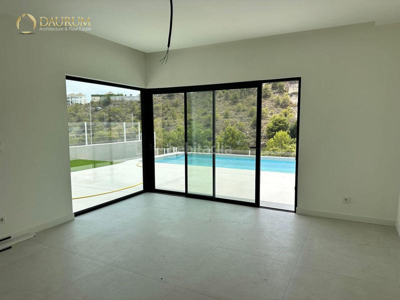 Foto d8c47594-9721-4f0a-aabe-11c862c0b209. Casa con riscaldamento parcheggio piscina in balcón de Finestrat-terra marina Finestrat