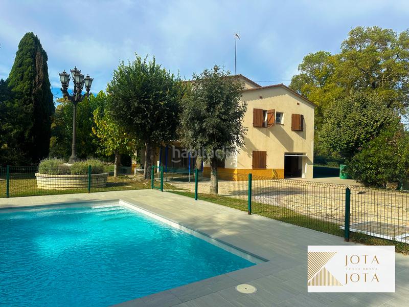 Foto 61459765-37c1-43f6-a57f-d3f3f3f8a49a. Maison avec cheminée chauffage parking piscine dans Caldes de Malavella