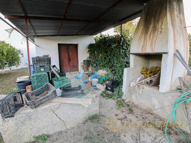 Foto d88373af-55ee-46c3-8ad6-da9fdc3c5f52. Masía se vende parcela con pequeña casa por cortijo benítez en Coín