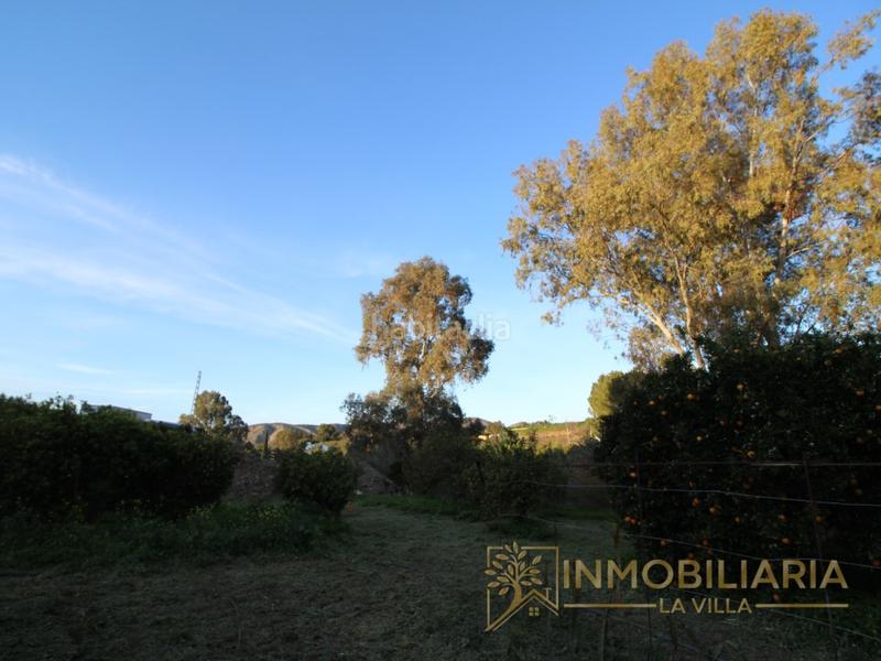 Foto 083bc4c3-cce3-46ac-a6d4-7b513b240fec. Terreno residencial excepcional terreno rustico con agua ,luz y vallado. en Alhaurín de la Torre