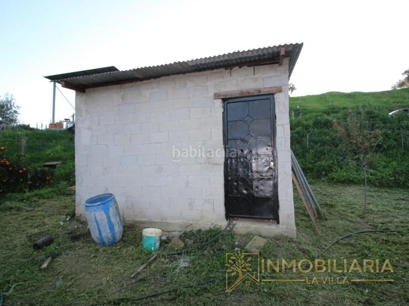 Foto 347fa2e2-8fbe-4ac5-9985-01fbb16f16e3. Terreno residencial excepcional terreno rustico con agua ,luz y vallado. en Alhaurín de la Torre