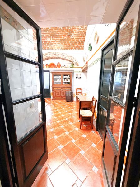 Foto 0da8aa75-38c6-4a4c-a6b2-46c2d42f5b08. Casa adossada amb xemeneia a Zafra