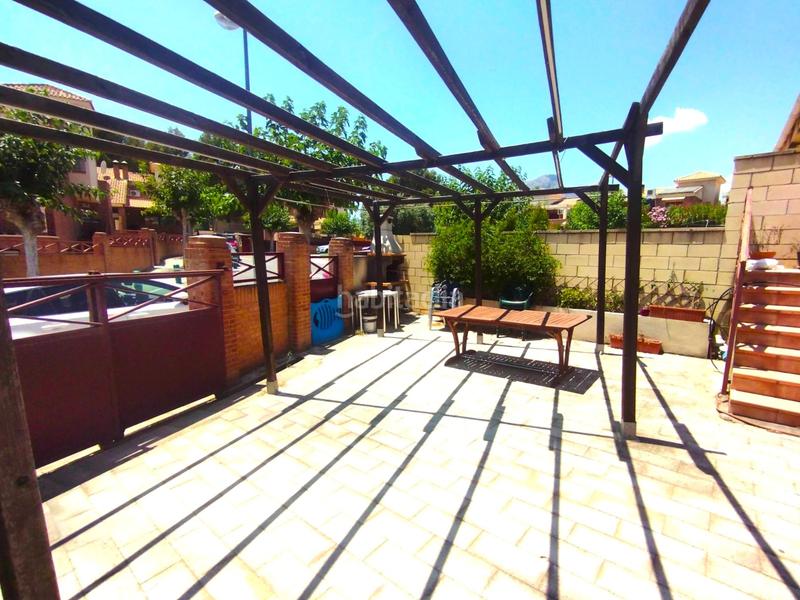 Foto 523e2a1e-906d-4318-a3b2-a8d6226452db. Casa adossada amb aparcament piscina a El Tossal-Bello Horizonte Nucia (la)