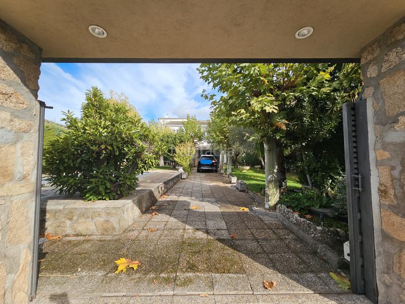 Foto f4abb34d-30d7-40e2-b03e-47eb0c984116. Xalet amb xemeneia calefacció aparcament piscina a Cabanillas de la Sierra