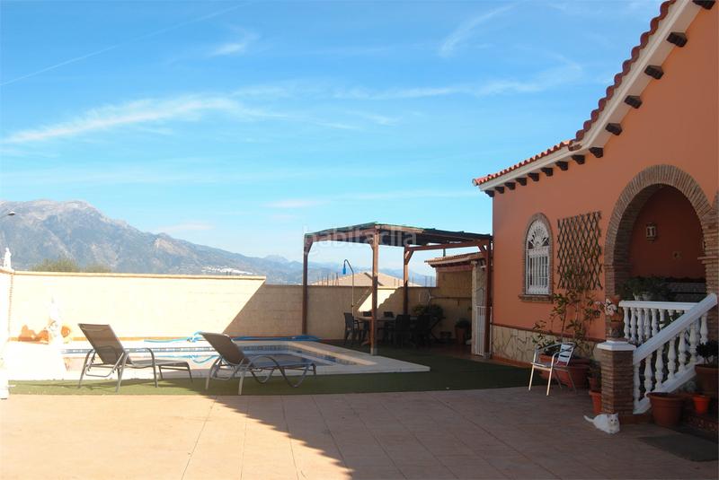 Foto 8a6a626c-a4d0-4299-bbab-722737f5b936. Casa amb xemeneia aparcament piscina a Viñuela