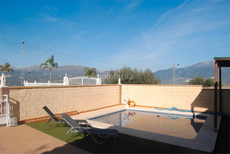 Foto b3411287-2d47-4c2a-988f-790c51c0a369. Casa amb xemeneia aparcament piscina a Viñuela