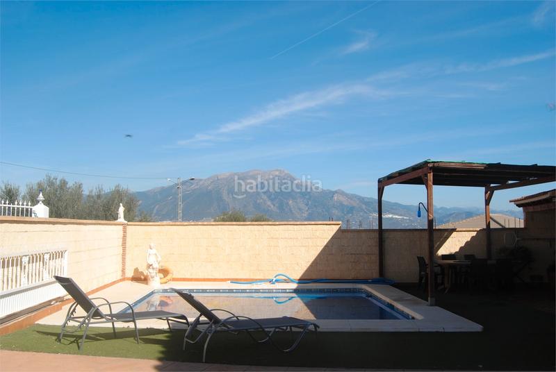 Foto f11d2522-7e0b-44f4-8302-80e4520a6dc4. Casa amb xemeneia aparcament piscina a Viñuela