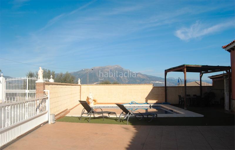 Foto fbfb7e5c-b34f-4279-bcdd-59dbeca32db2. Casa amb xemeneia aparcament piscina a Viñuela