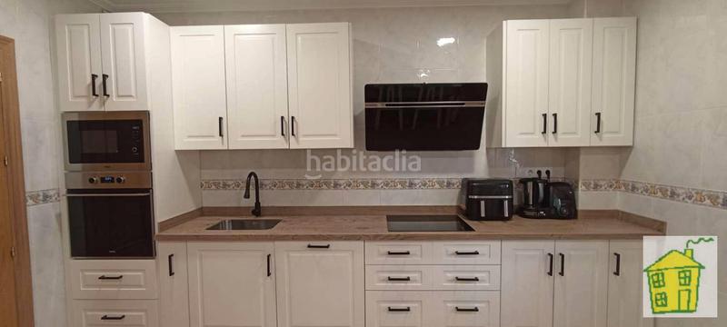 Foto 04e15431-f2af-434b-b705-c37c18c785ad. Casa adossada amb xemeneia calefacció a Andújar