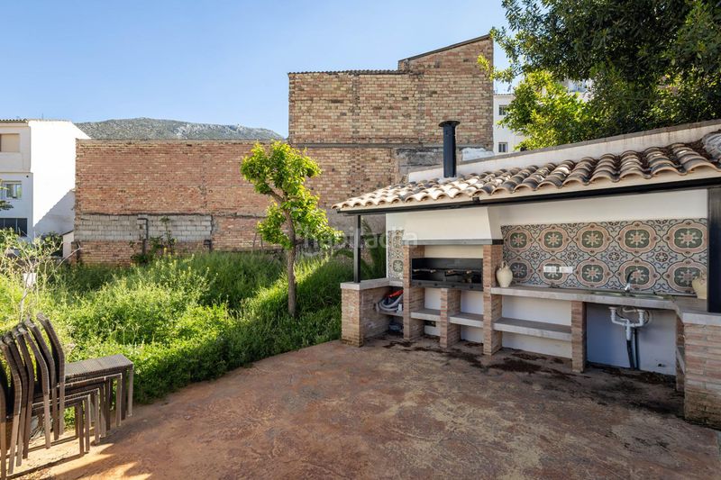 Foto 74ee4e65-9cd1-4927-83ed-be7748bbbc36. Casa adossada a Loja