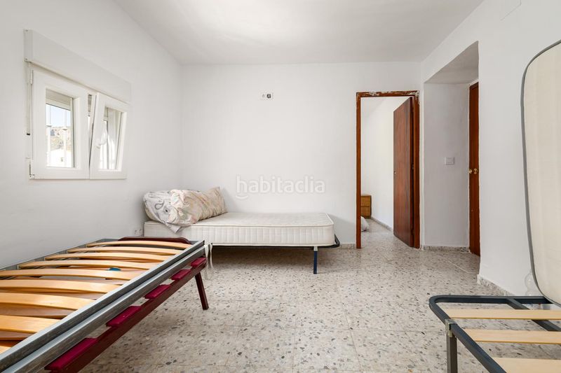 Foto c9872060-d7e4-4f10-8b61-523ff7d60b2f. Casa adossada a Loja