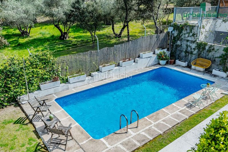 Foto 9a5c5beb-7278-43ae-a13a-5dd19af5ad9b. Casa aparellada amb calefacció piscina a Valdemarín Madrid