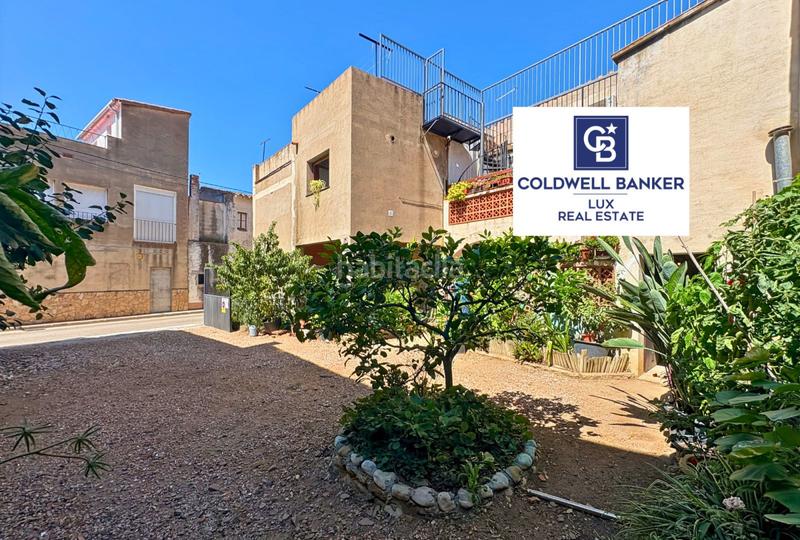 Foto 958604dd-4848-467a-80ab-208a63c16a4c. Casa adosada encantadora casa en medio del pueblo de palau saverdera, con vistas desde las terrazas a las montañas y con posibilidad de constru en Palau-saverdera