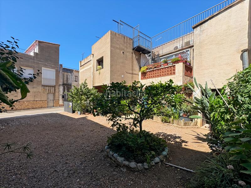 Foto f66aea1a-049e-445c-b24d-492ec5c242c5. Casa adosada encantadora casa en medio del pueblo de palau saverdera, con vistas desde las terrazas a las montañas y con posibilidad de constru en Palau-saverdera