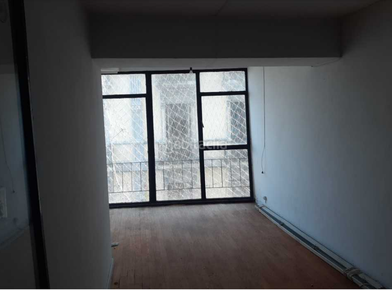 Foto 8c65666d-8d66-4e6e-b909-caf1d6353d1c. Terreno residencial edificio en obra parada en Navia