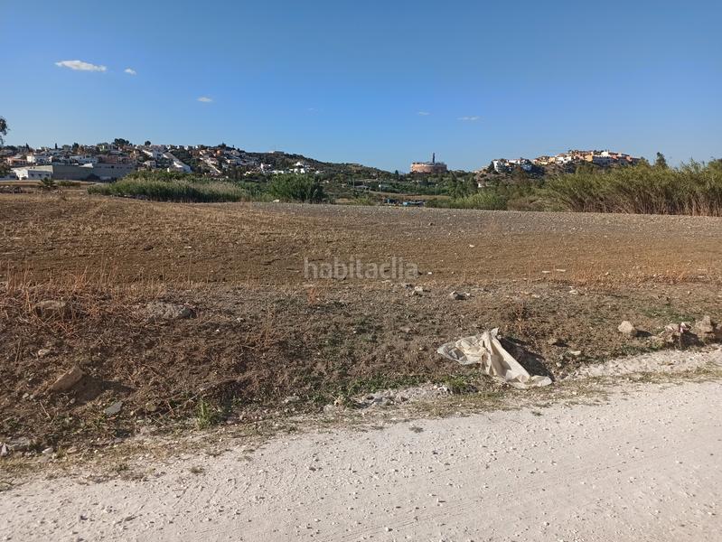 Foto d78e5e8d-26b5-4365-b7a2-29884b81d0da. Terrain industriel dans Coín