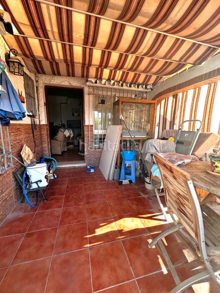 Foto 3d37a557-c29f-4d8f-af4c-e7e09639f8cc. Reihenhaus mit kamin in Coín