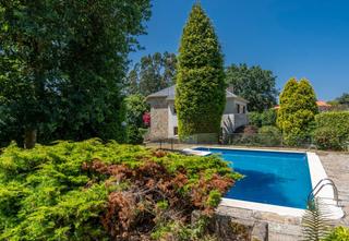 Casa en Aldea de arriba 61. Una casa con un jardn diseado a lo grande